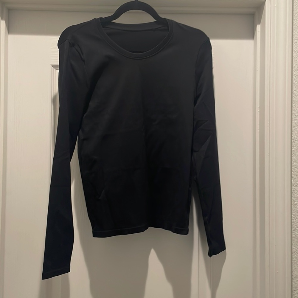 NWOT OQQ compressive long sleeve top.
